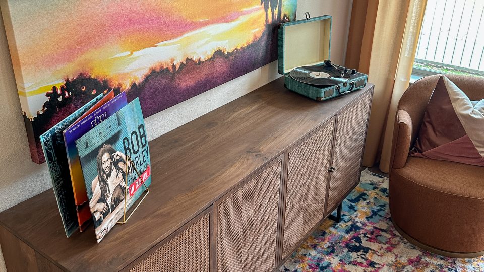 a colorful rug and a painting on the wall at The Lofts at Allen Ridge